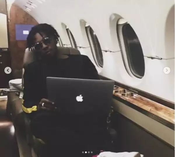Runtown shows off bundles of dollars on a private jet!
